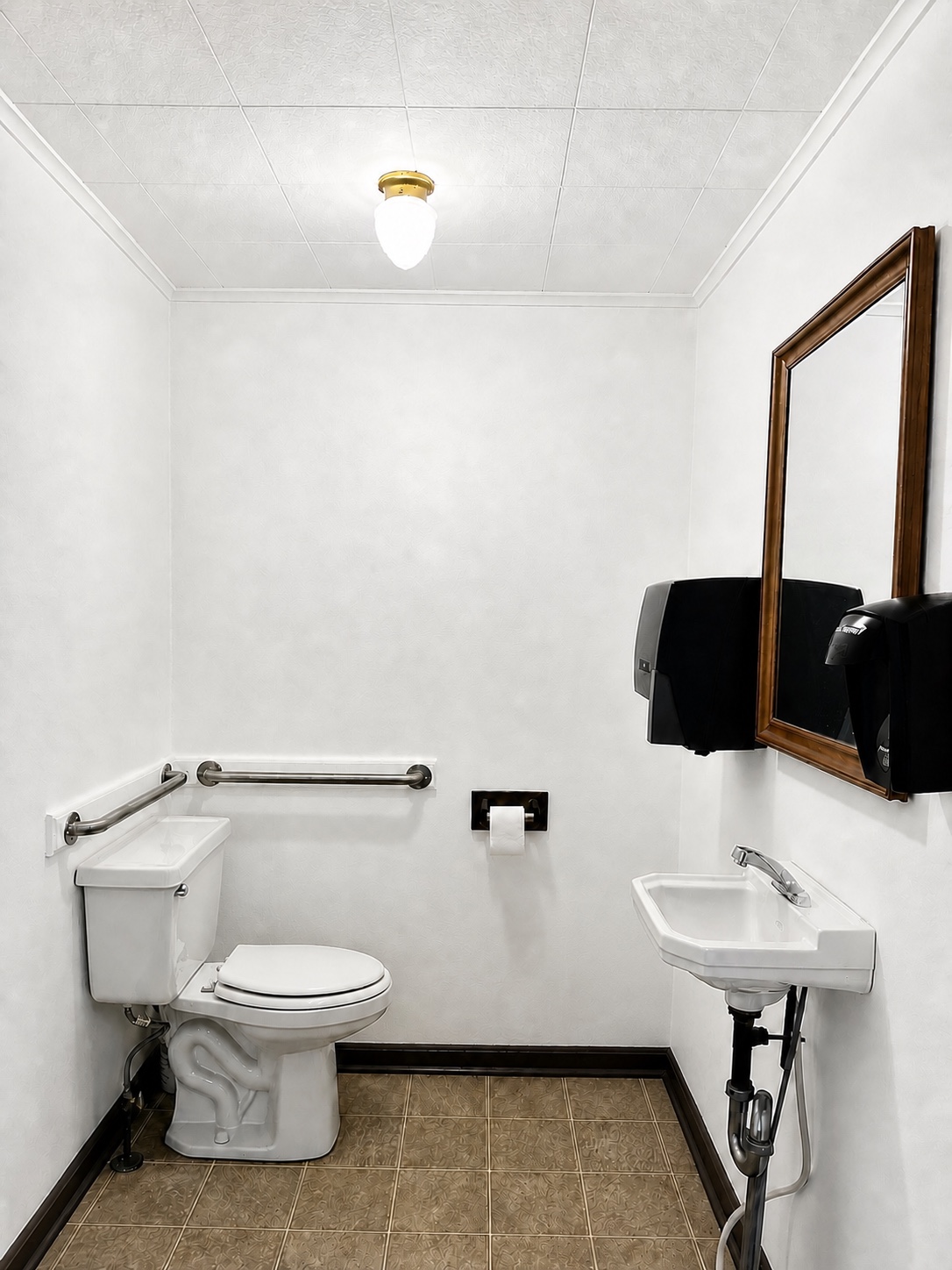 Accessible restaurant bathroom with grab bars, closed toilet, and hand sink
